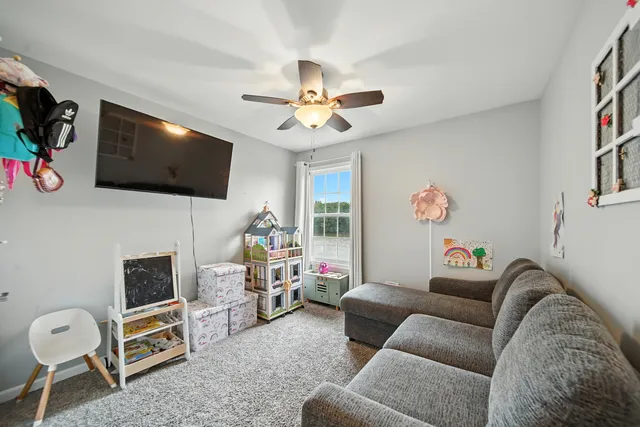 a bed room with a bed and a large window