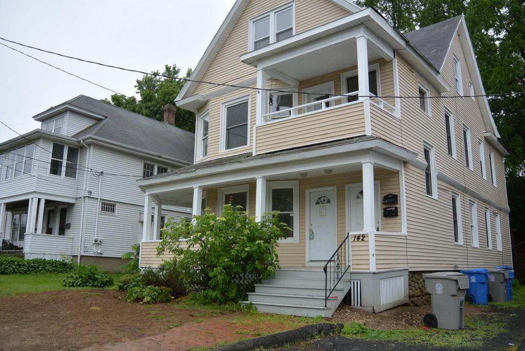 142 Federal Street Bristol, CT 06010 - Photo 1 of 1 a front view of a house with a garden