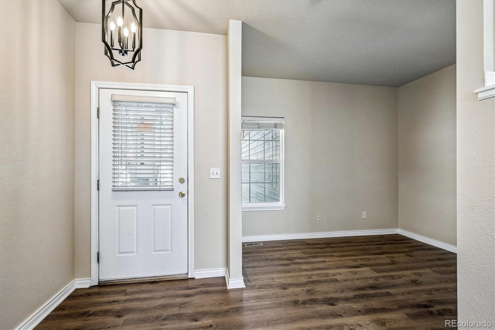 4545 South Taft Way Morrison, CO 80465 - Photo 12 of 19 a view of empty room with wooden floor and fan