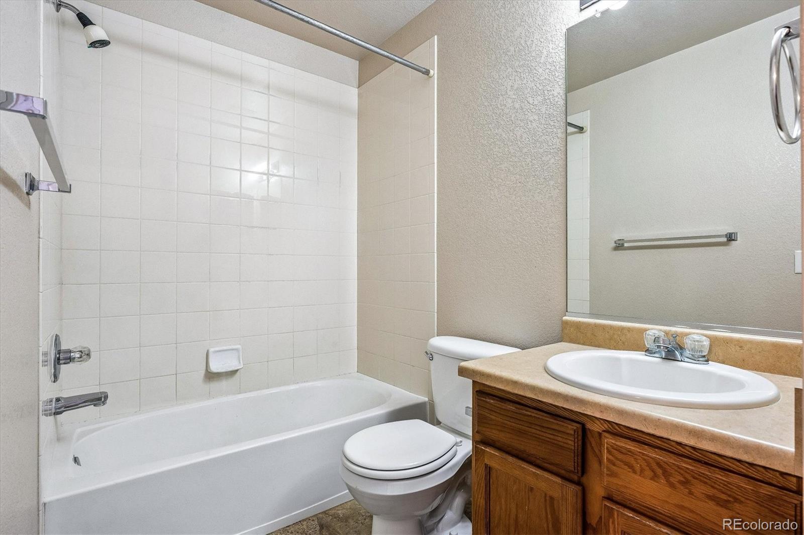 4545 South Taft Way Morrison, CO 80465 - Photo 17 of 19 a bathroom with a sink toilet and shower