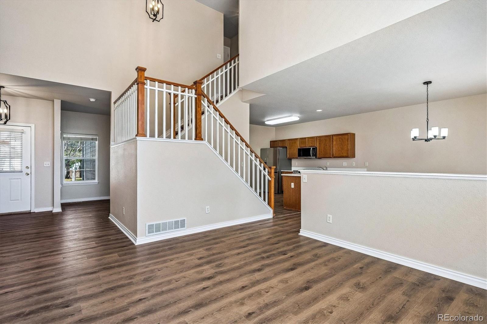4545 South Taft Way Morrison, CO 80465 - Photo 6 of 19 a view of a livingroom with wooden floor