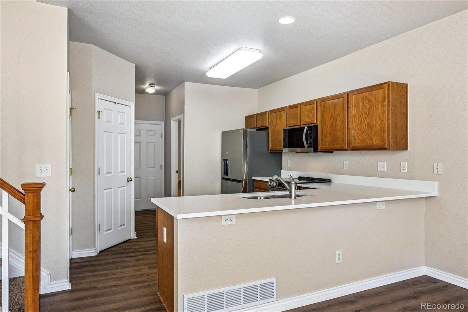 4545 South Taft Way Morrison, CO 80465 - Photo 7 of 19 a room with stainless steel appliances wooden floors and view living room