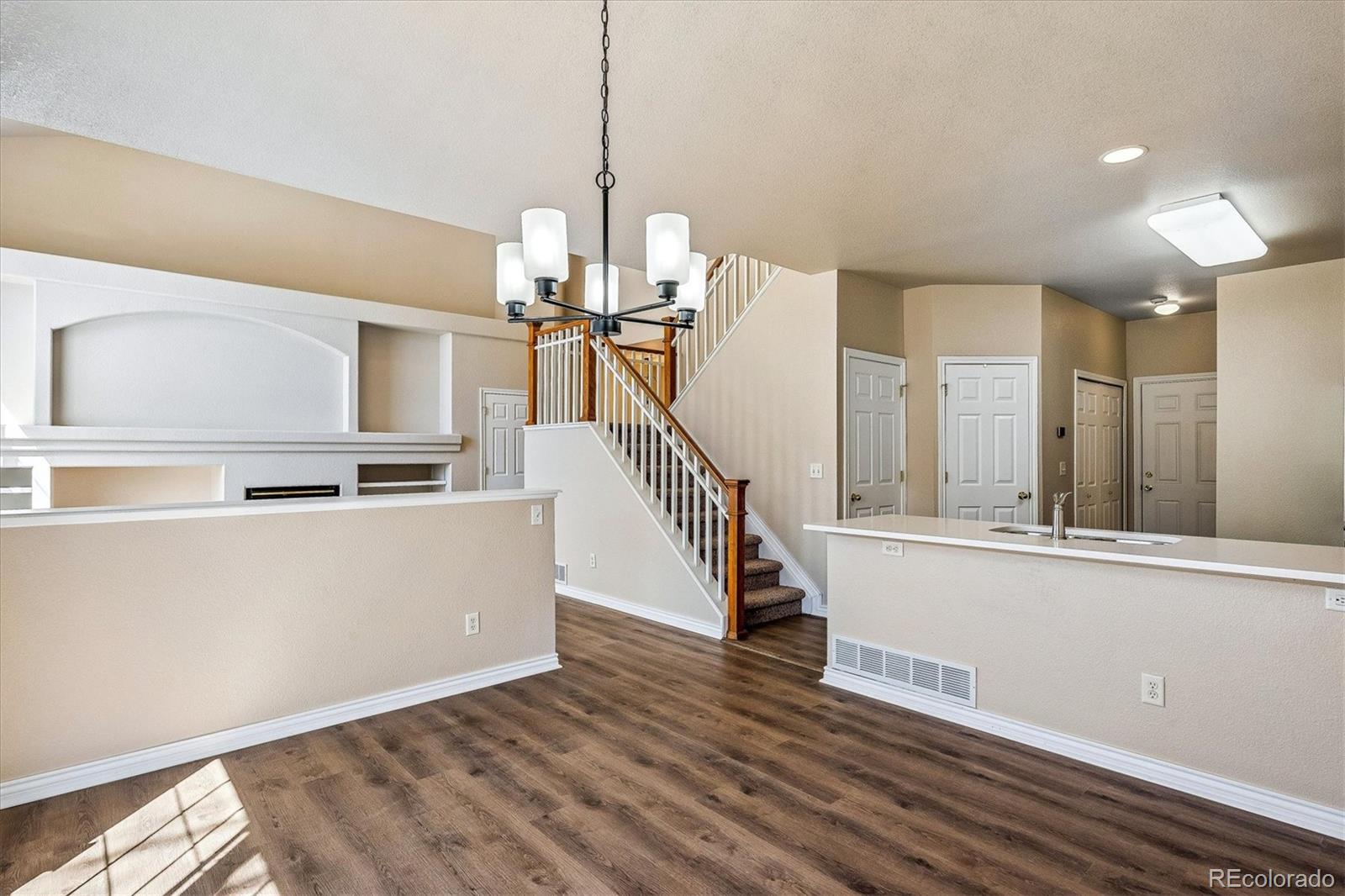 4545 South Taft Way Morrison, CO 80465 - Photo 10 of 19 a view of a room with wooden floor and staircase