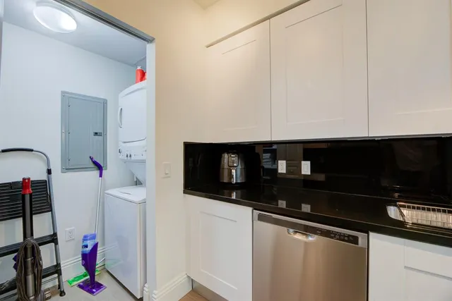 a close view of a sink a microwave and cabinets