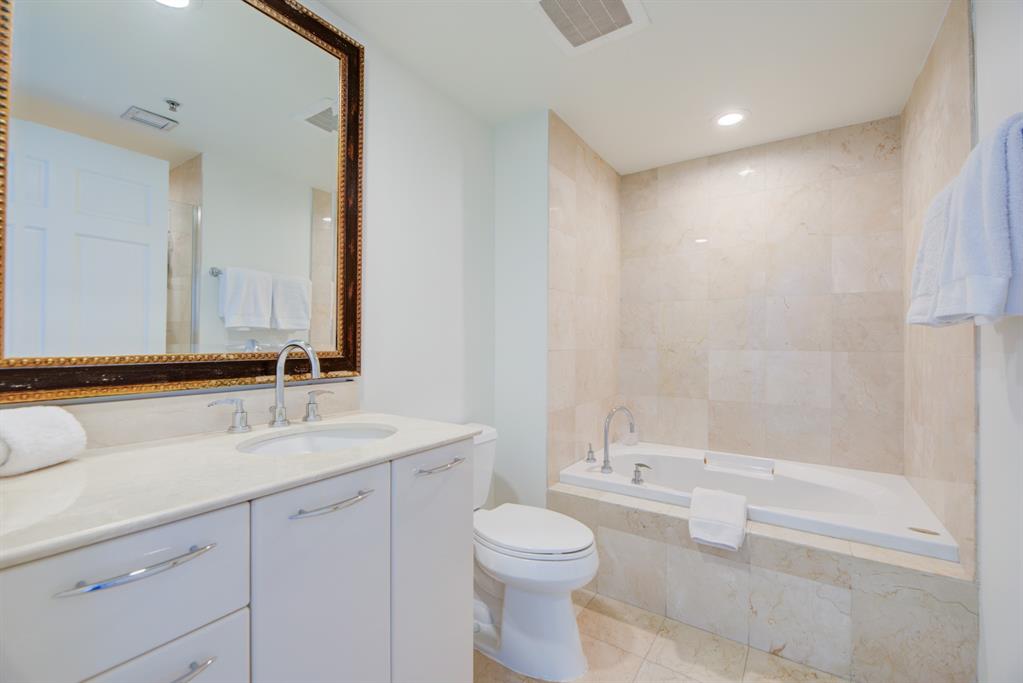 350 Southeast 2nd Street, Unit 1680 Fort Lauderdale, FL 33301 - Photo 20 of 35 a bathroom with a sink a toilet and shower