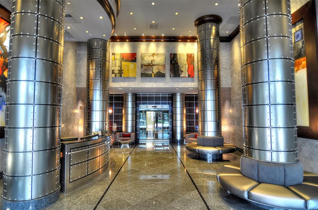 350 Southeast 2nd Street, Unit 1680 Fort Lauderdale, FL 33301 - Photo 28 of 35 a view of a building with a couch and a garage