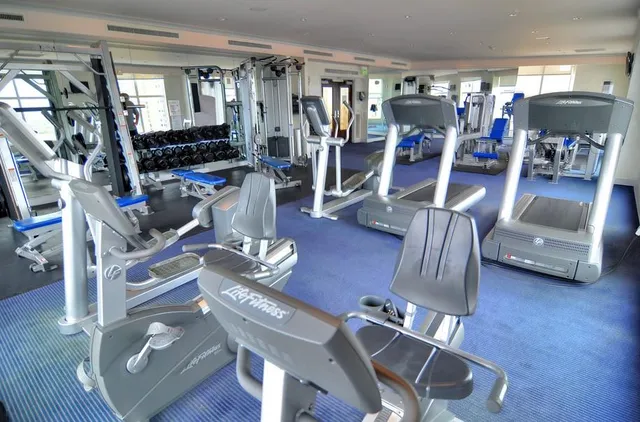 a view of a room with lots of wooden furniture