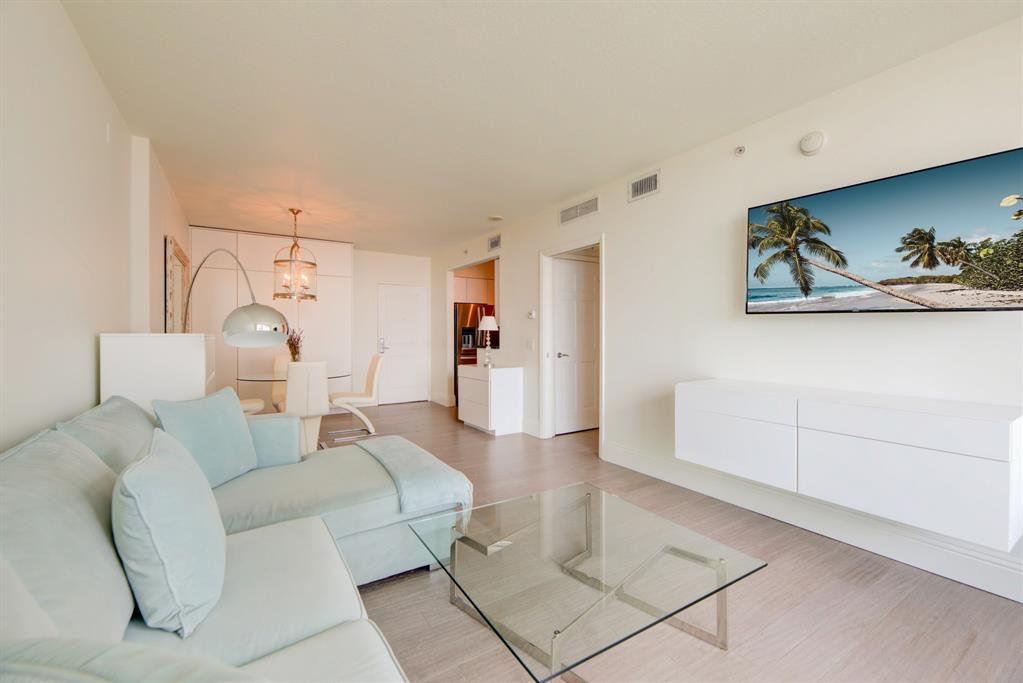350 Southeast 2nd Street, Unit 1680 Fort Lauderdale, FL 33301 - Photo 8 of 35 a living room with furniture and white walls