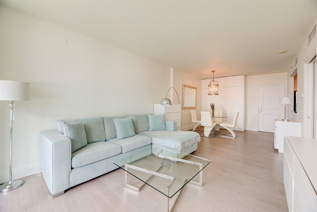 350 Southeast 2nd Street, Unit 1680 Fort Lauderdale, FL 33301 - Photo 9 of 35 a living room with furniture and a couch