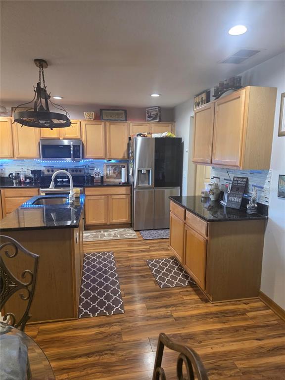 959 Thomas Road Eagle Lake, FL 33839 - Photo 19 of 35 a kitchen with stainless steel appliances granite countertop a sink stove and refrigerator