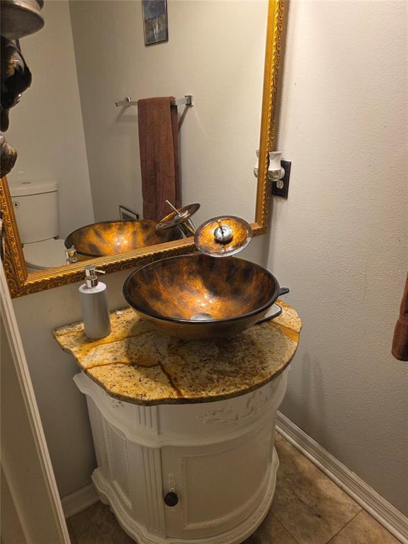 959 Thomas Road Eagle Lake, FL 33839 - Photo 33 of 35 a view of a sink with wooden tub