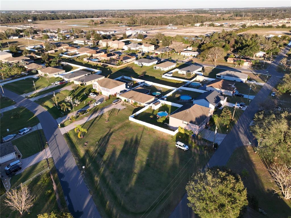 959 Thomas Road Eagle Lake, FL 33839 - Photo 6 of 35 an aerial view of residential houses with outdoor space