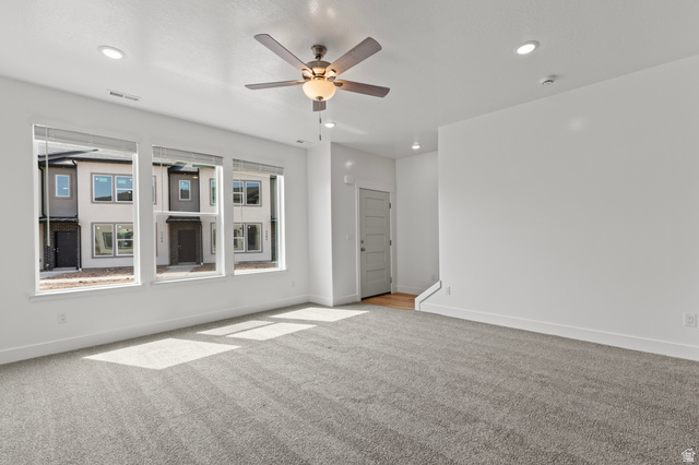 3410 South 1010th Street West Logan, UT 84321 - Photo 5 of 15 Spare room featuring carpet, a ceiling fan, and recessed lighting