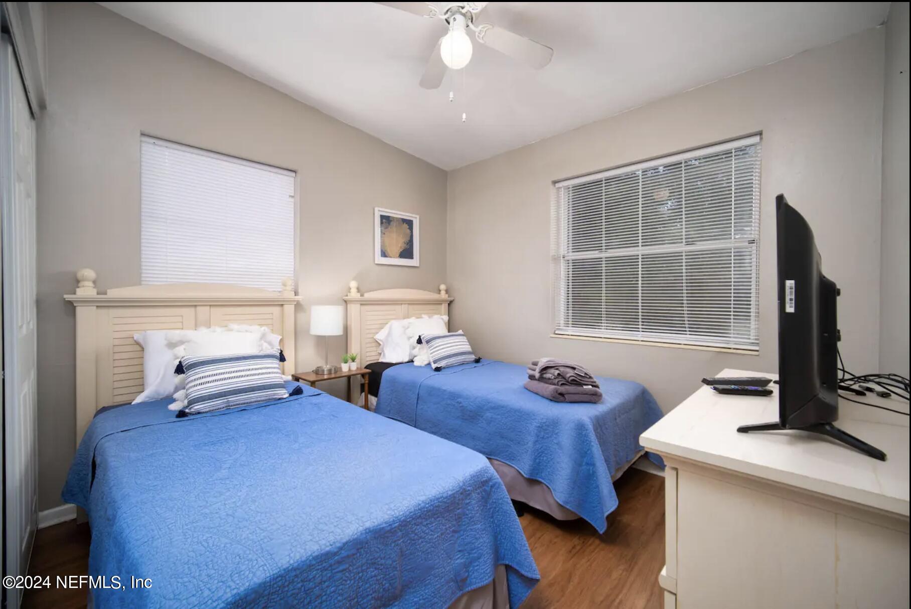 7466 Proxima Road Jacksonville, FL 32210 - Photo 24 of 34 a bedroom with two beds and a window