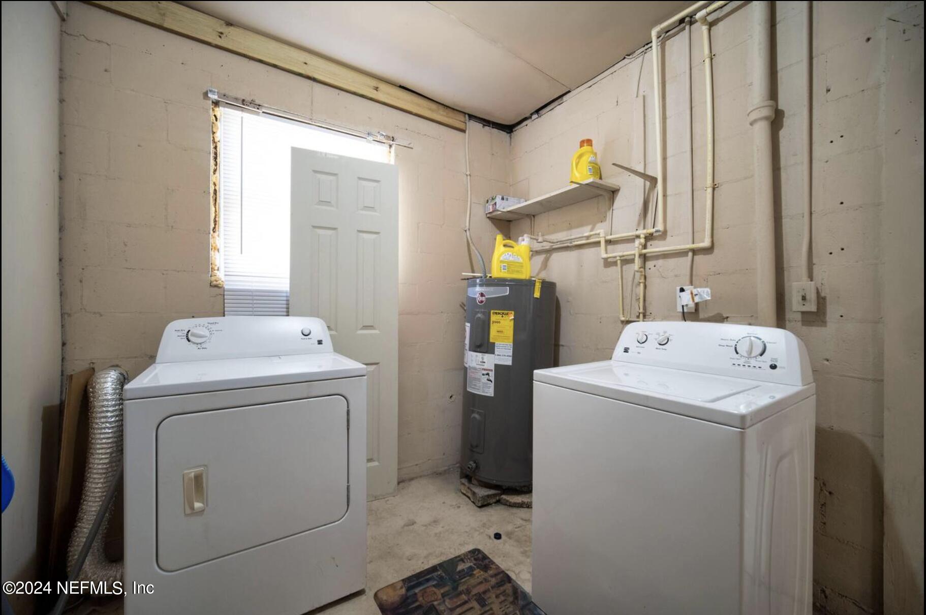 7466 Proxima Road Jacksonville, FL 32210 - Photo 27 of 34 a utility room with dryer and washer