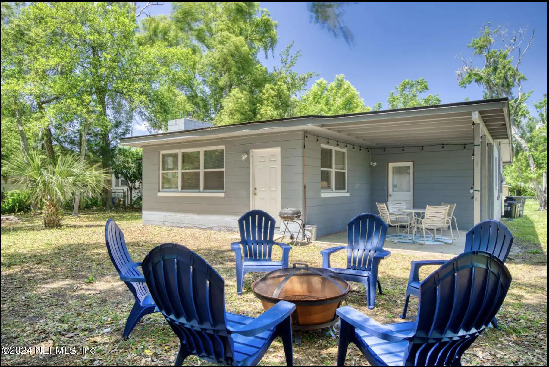 7466 Proxima Road Jacksonville, FL 32210 - Photo 31 of 34 a view of a house with backyard and sitting area