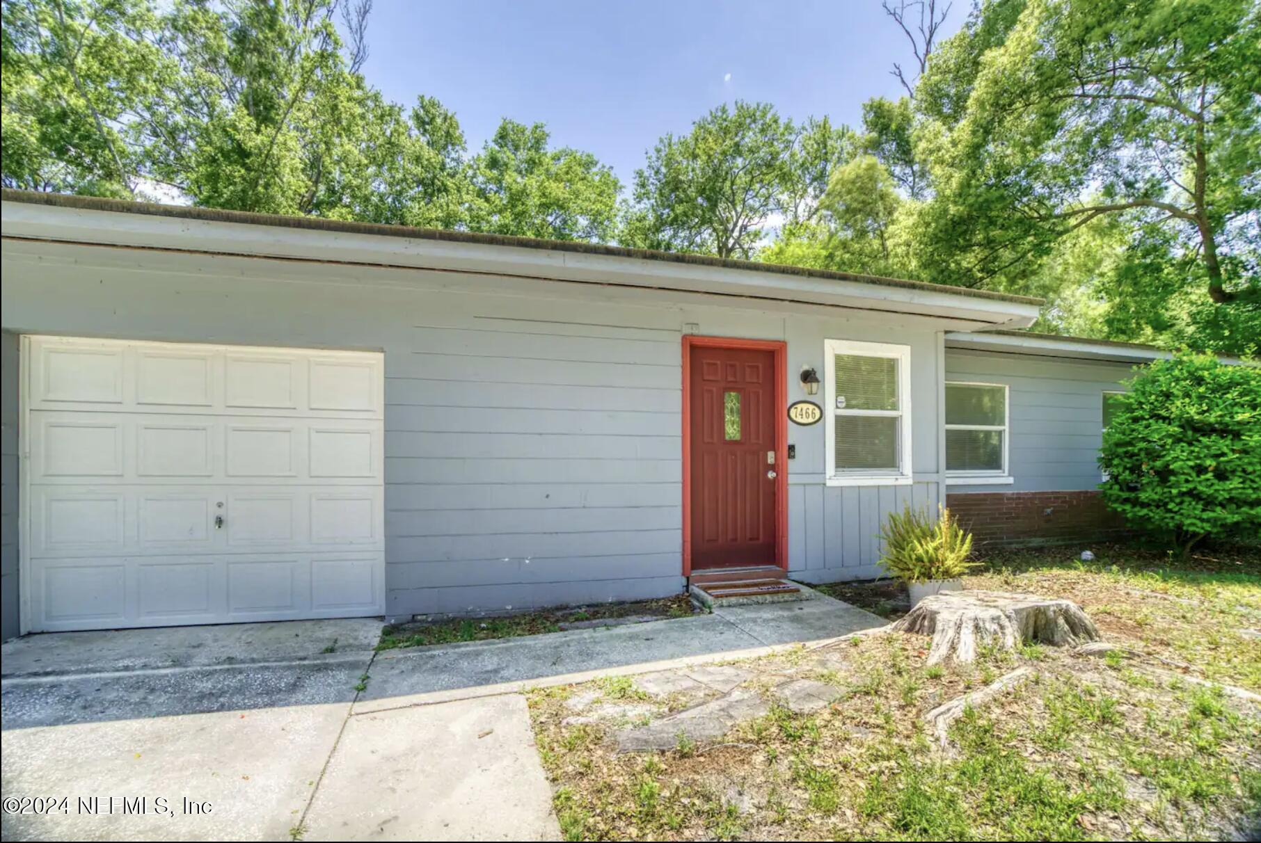 7466 Proxima Road Jacksonville, FL 32210 - Photo 4 of 34 a view of a house with a yard