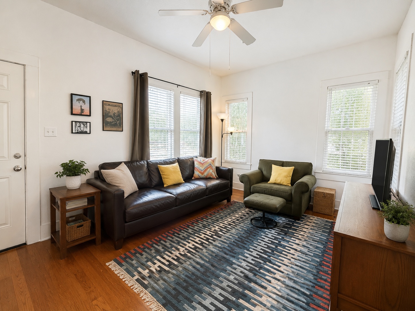 404 West 43rd Street, Unit A Austin, TX 78751 - Photo 2 of 10 a living room with furniture a flat screen tv and a window