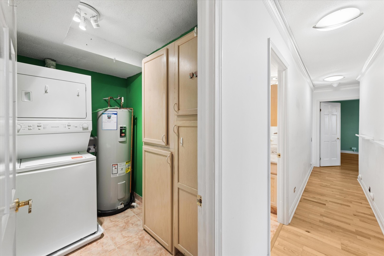 2 South Atrium Way, Unit 603 Elmhurst, IL 60126 - Photo 13 of 16 a view of a hallway with a washer and dryer