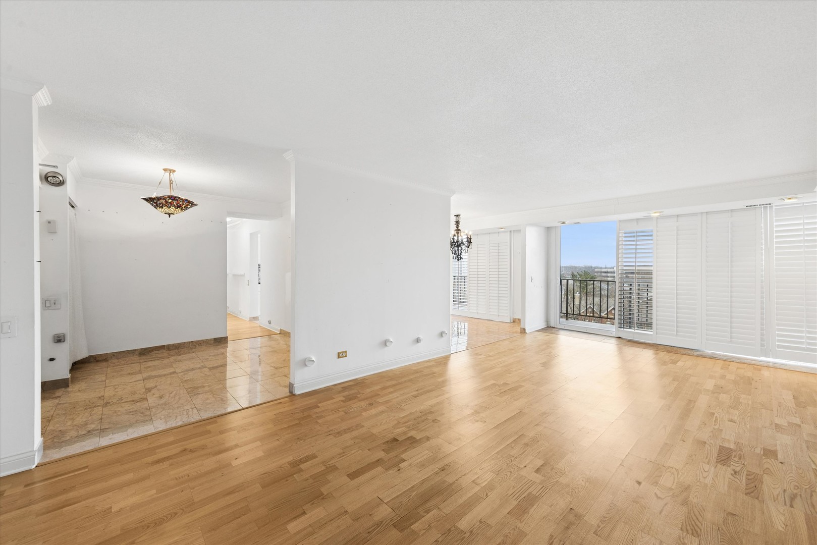2 South Atrium Way, Unit 603 Elmhurst, IL 60126 - Photo 6 of 16 an empty room with wooden floor and windows