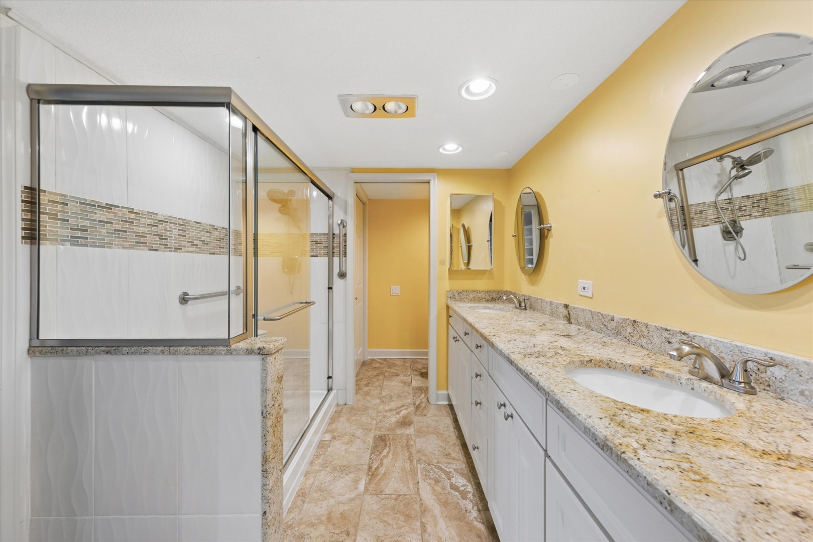2 South Atrium Way, Unit 603 Elmhurst, IL 60126 - Photo 7 of 16 a spacious bathroom with a granite countertop sink mirror and double