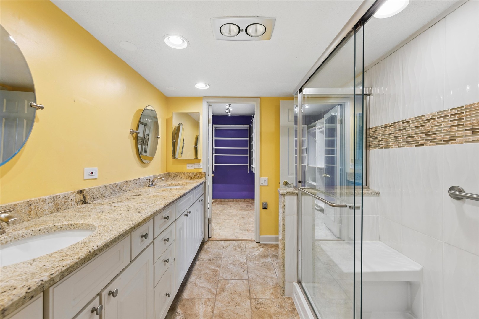 2 South Atrium Way, Unit 603 Elmhurst, IL 60126 - Photo 8 of 16 a bathroom with a granite countertop sink a mirror and shower