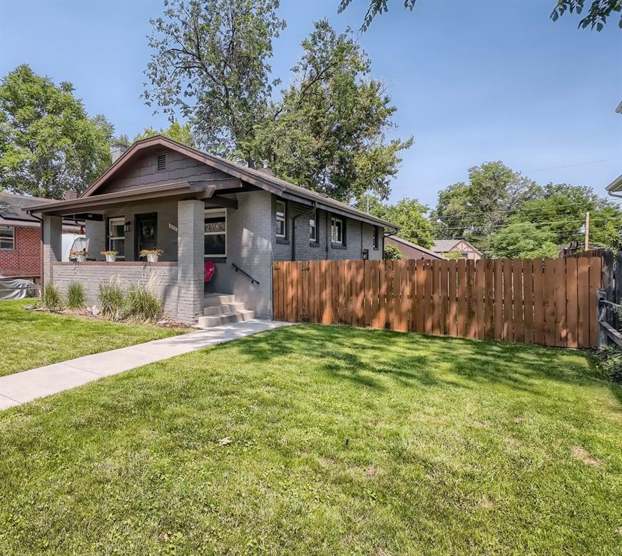 4140 Decatur Street Denver, CO 80211 - Photo 1 of 33 a front view of a house with garden
