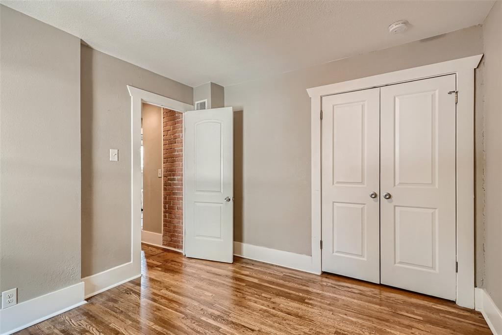 4140 Decatur Street Denver, CO 80211 - Photo 14 of 33 an empty room with wooden floor and closet area