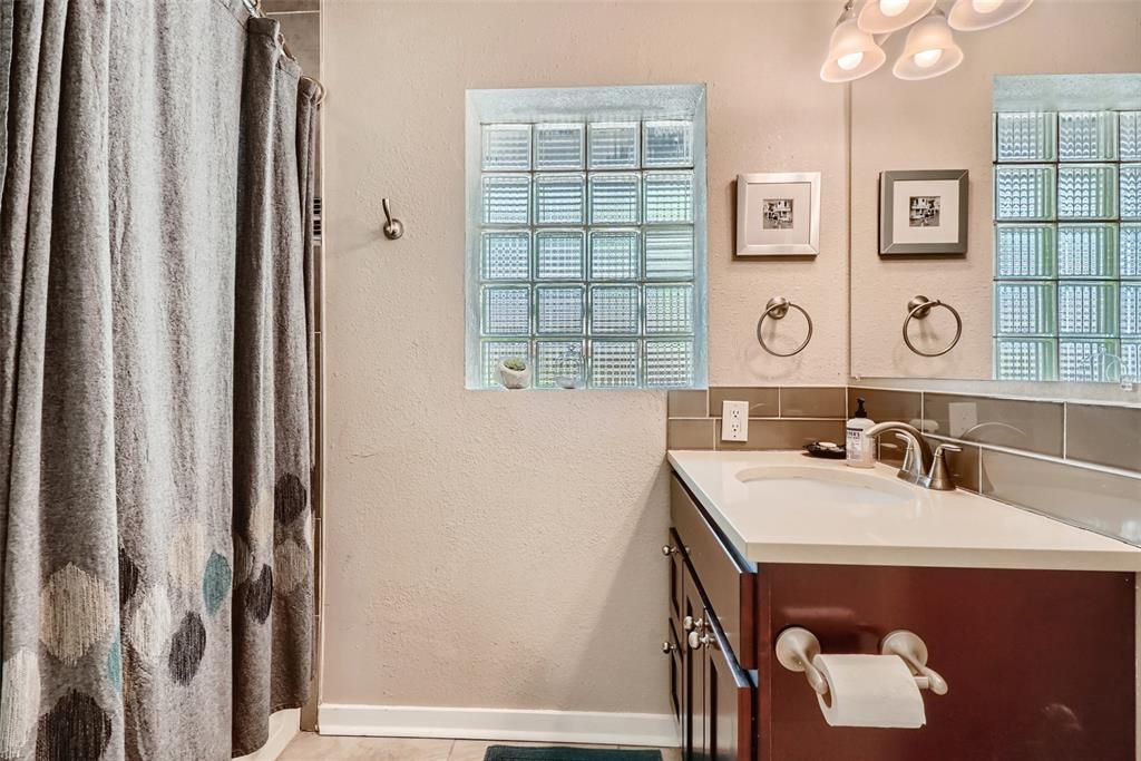 4140 Decatur Street Denver, CO 80211 - Photo 15 of 33 a bathroom with a sink and a mirror