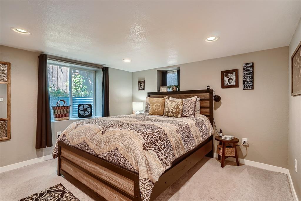 4140 Decatur Street Denver, CO 80211 - Photo 19 of 33 a bedroom with a bed and window