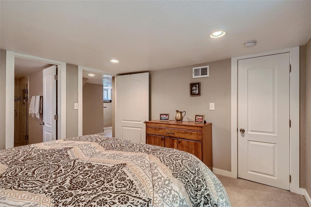 4140 Decatur Street Denver, CO 80211 - Photo 20 of 33 a bedroom with a bed and a dresser