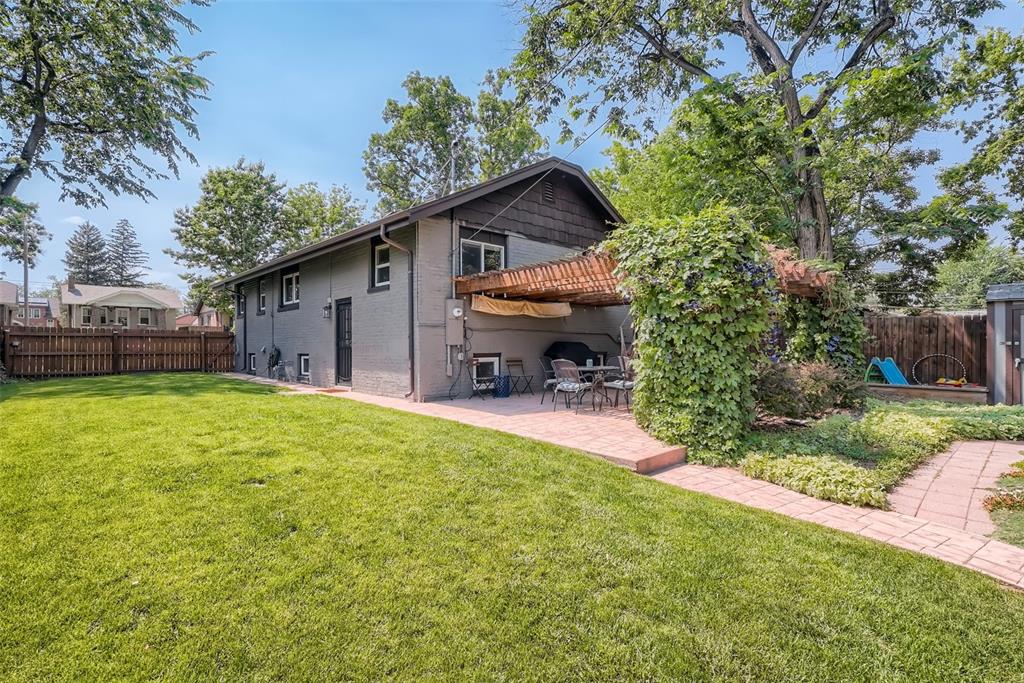 4140 Decatur Street Denver, CO 80211 - Photo 27 of 33 a backyard of a house with table and chairs