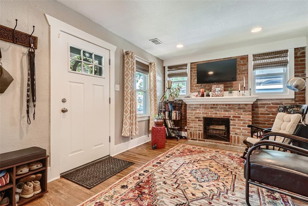 4140 Decatur Street Denver, CO 80211 - Photo 4 of 33 a living room with furniture and a fireplace