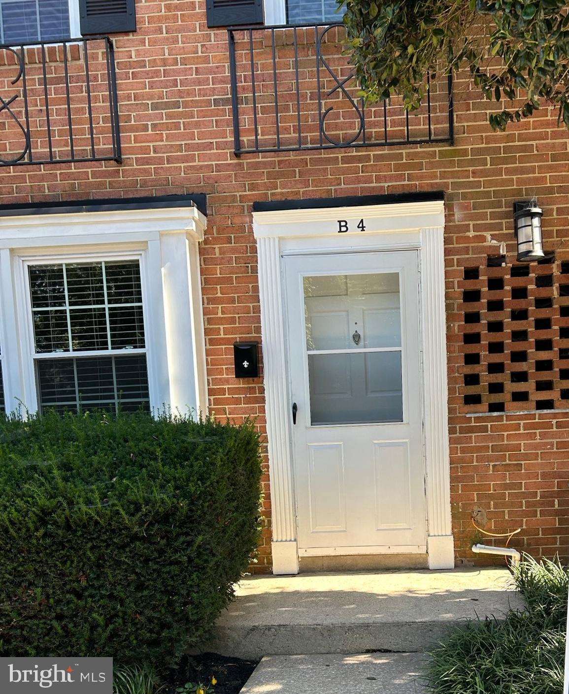 1600 Ruxton Road, Unit B4 Baltimore, MD 21204 - Photo 1 of 21 a front view of a house with a garden