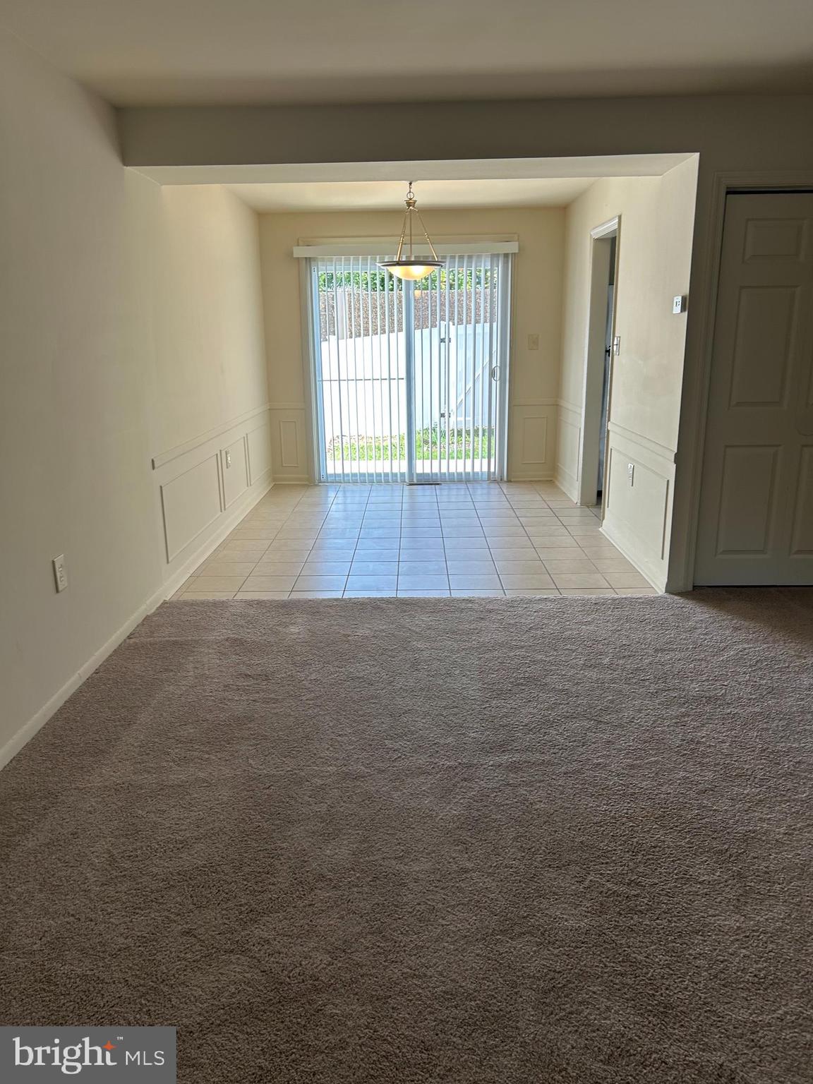 1600 Ruxton Road, Unit B4 Baltimore, MD 21204 - Photo 4 of 21 a view of an empty room with a window