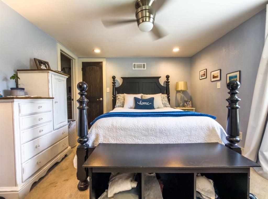 14275 Gholson Road Gholson, TX 76705 - Photo 13 of 22 Recessed lighting illuminates this space featuring a ceiling fan with integrated lighting, a dark wood-finish door, and a built-in wall vent