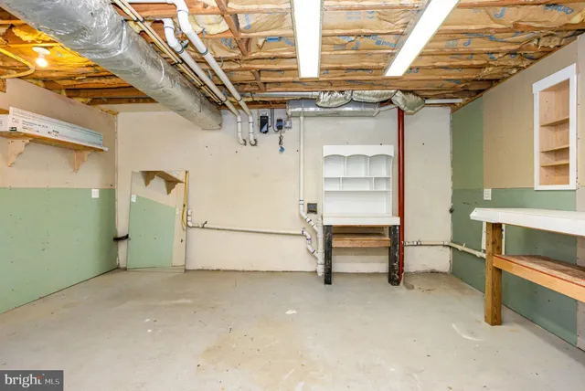 a utility room with cabinets washer and dryer
