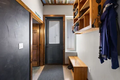 a bedroom with a bed and a lamp