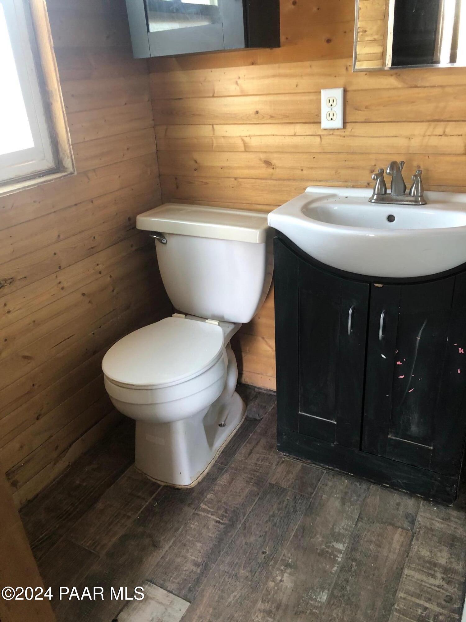 3669 Verde Road Williams, AZ 86046 - Photo 23 of 26 a bathroom with a toilet sink and mirror
