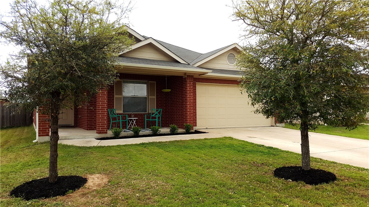 537 MacKenzie Way Leander, TX 78641 - Photo 1 of 1 a front view of a house with garden