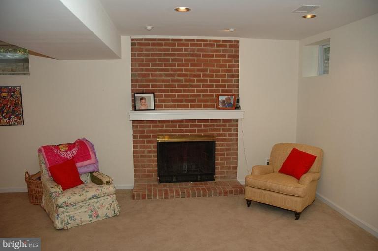 11926 Riders Lane Reston, VA 20191 - Photo 25 of 26 Cozy Rec Room Fireplace