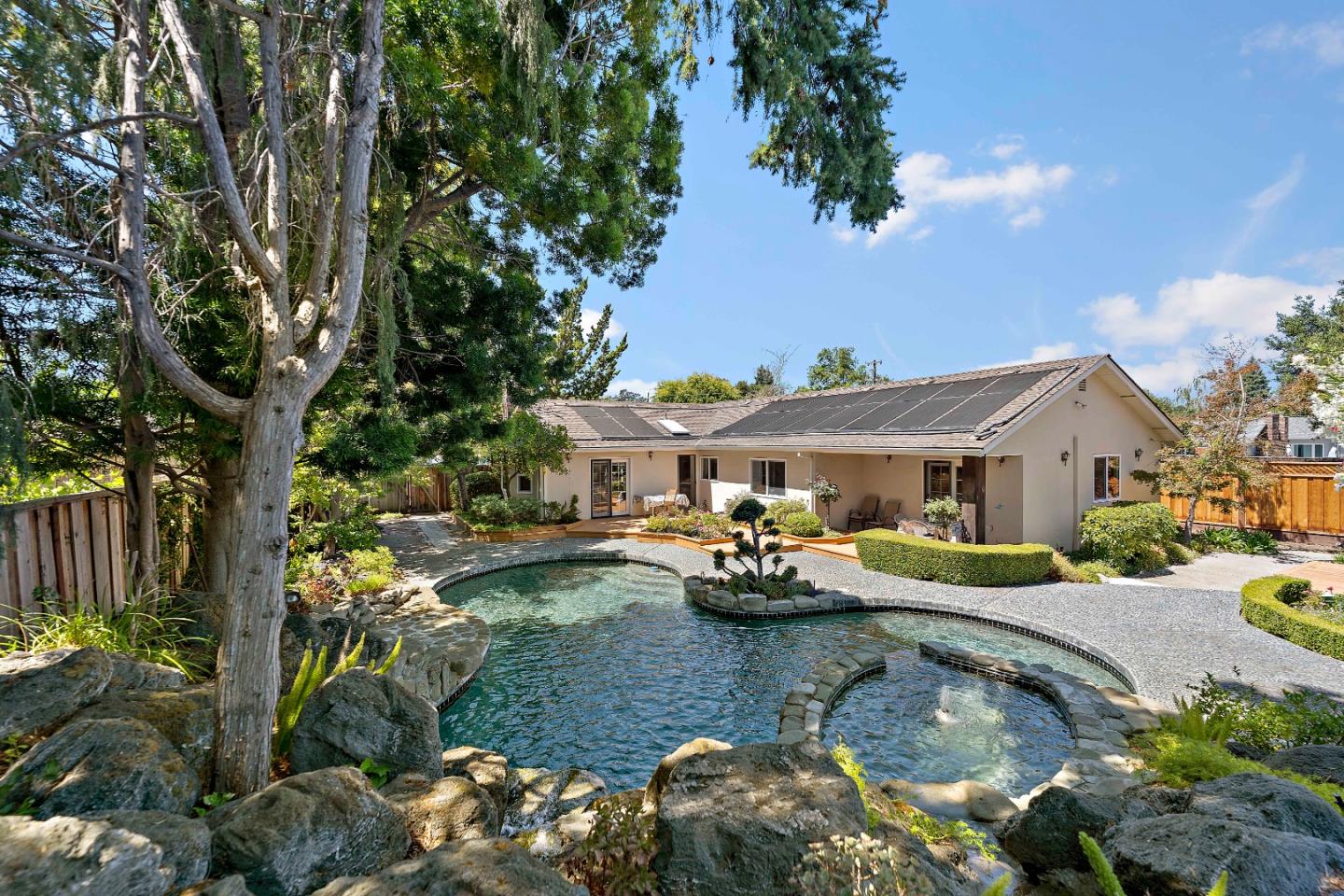 861 Riverside Drive Los Altos, CA 94024 - Photo 1 of 1 a view of a house with swimming pool and sitting area