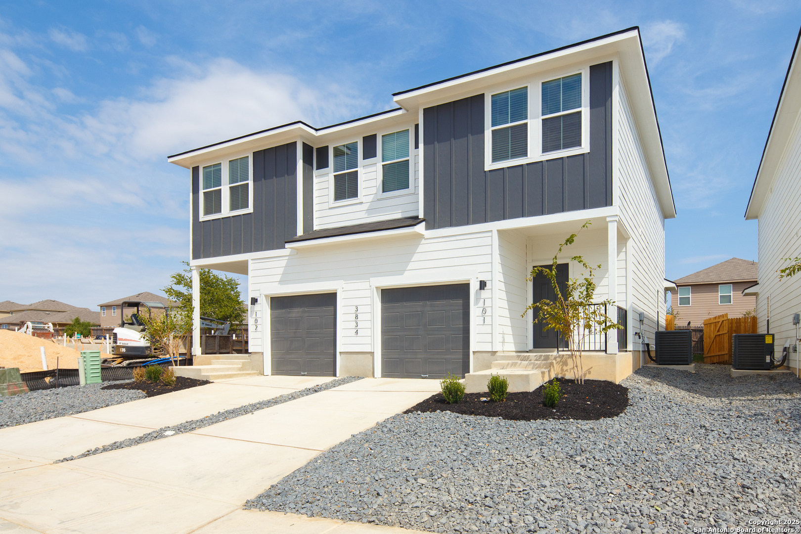 3924 Abbott Pass, Unit 101 St. Hedwig, TX 78152 - Photo 2 of 17 a view of a building with car parked