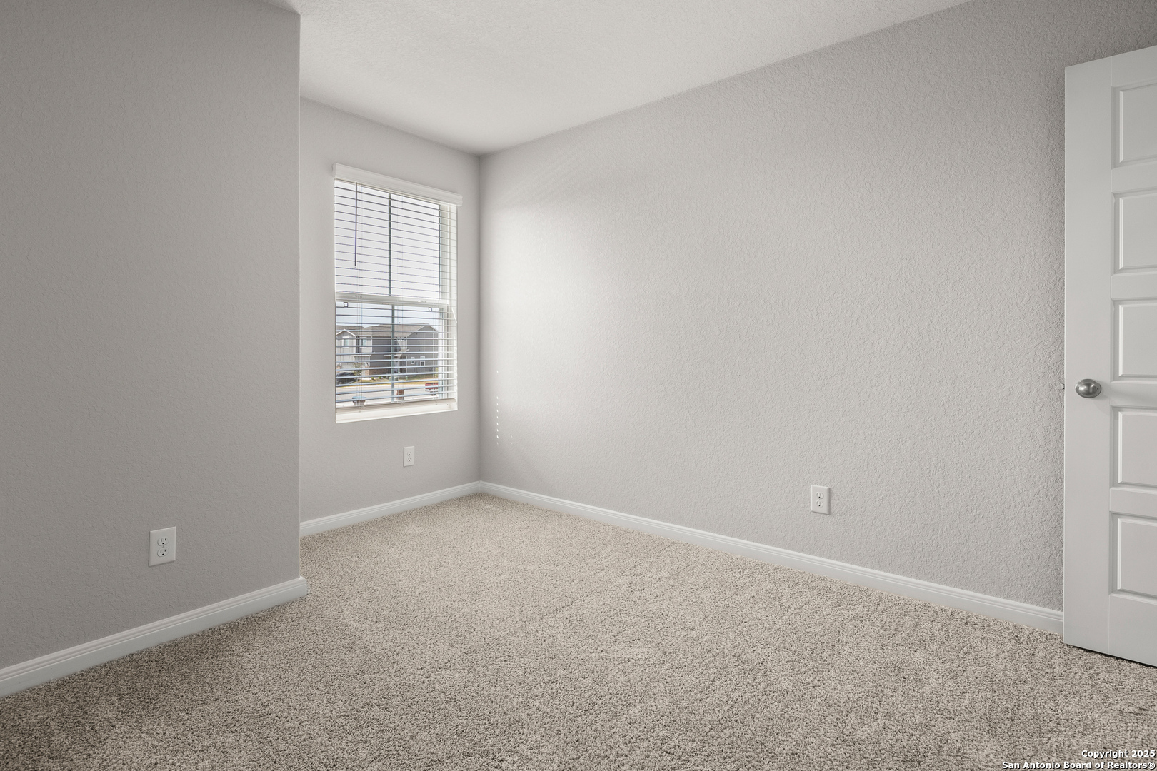 3924 Abbott Pass, Unit 101 St. Hedwig, TX 78152 - Photo 10 of 17 an empty room with windows