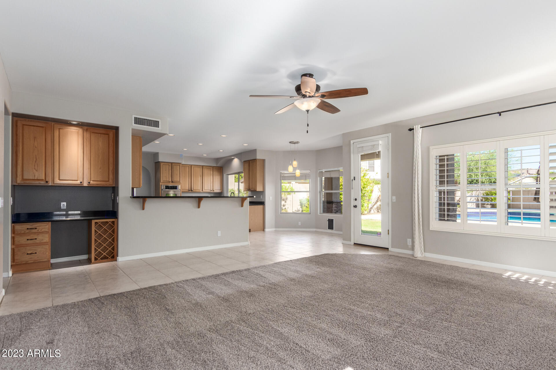 3160 East Desert Willow Road Phoenix, AZ 85048 - Photo 26 of 77 Family Room to Kitchen