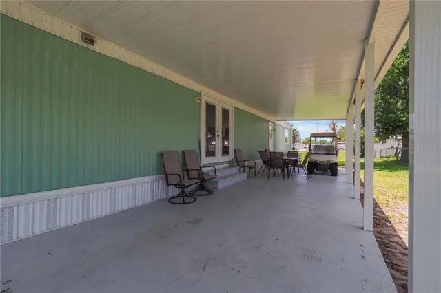 a living room with furniture and a garden