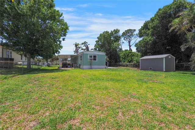 a house view with a sitting space and garden