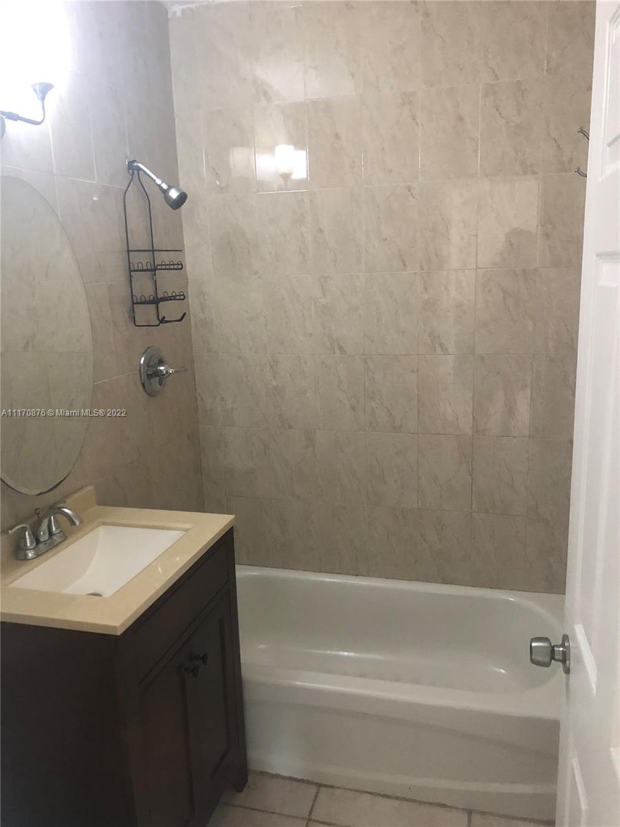 4001 Northwest 3rd Street Miami, FL 33126 - Photo 12 of 17 a bathroom with a sink and a mirror
