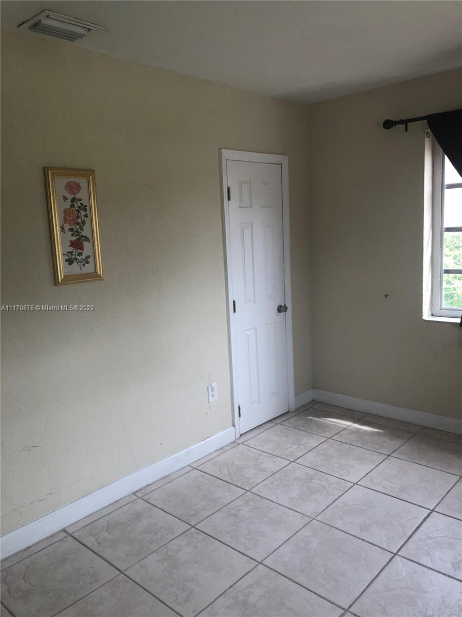 4001 Northwest 3rd Street Miami, FL 33126 - Photo 13 of 17 an empty room with windows