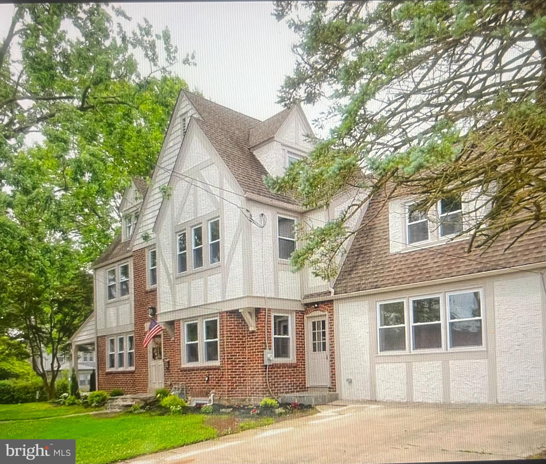 4001 State Road Upper Darby, PA 19026 - Photo 2 of 9 a front view of a house with a garden and tree